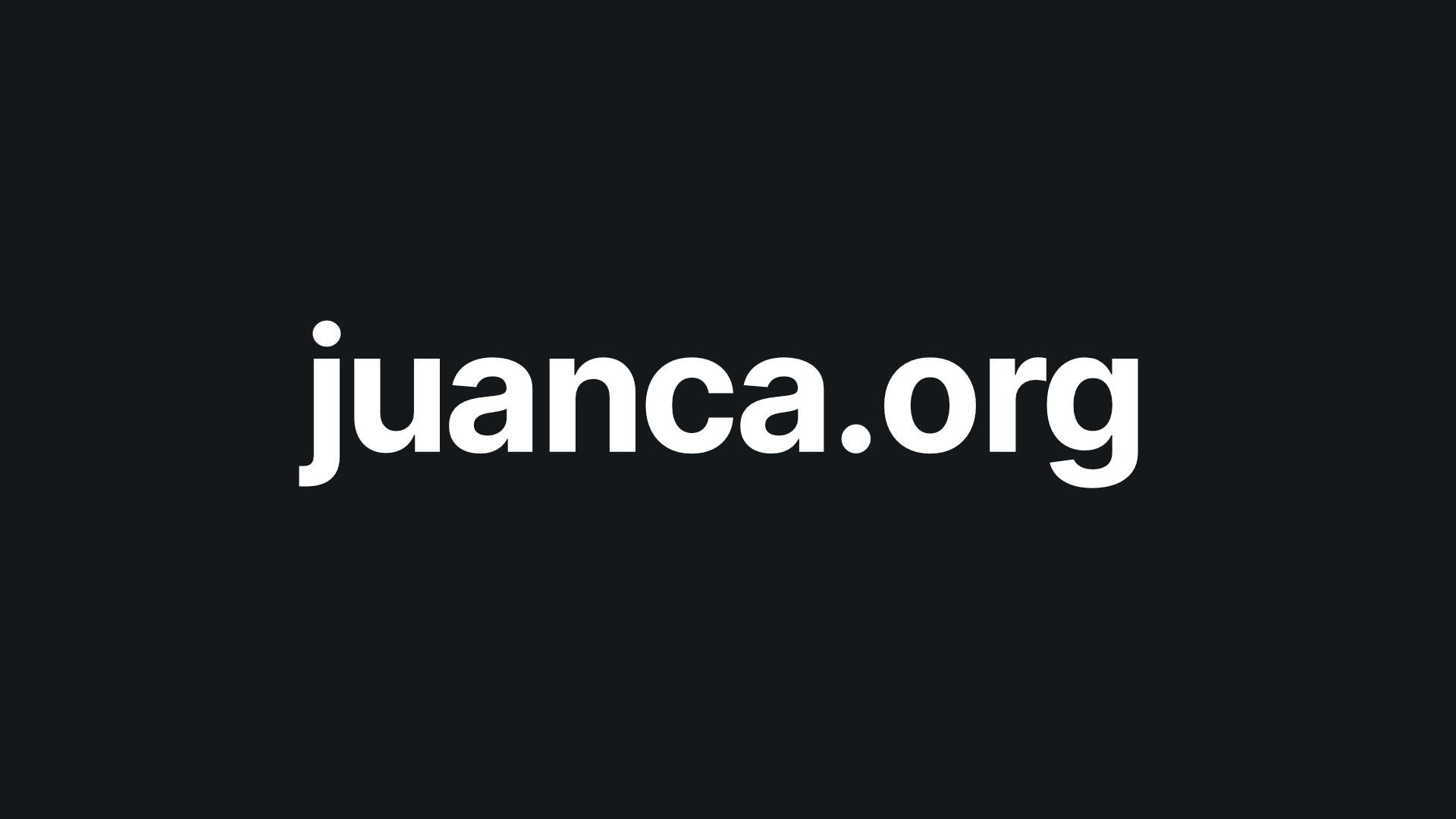 White "juanca.org" capitalized at the center in a black background.
